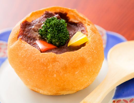Tongue stew in a bread bowl